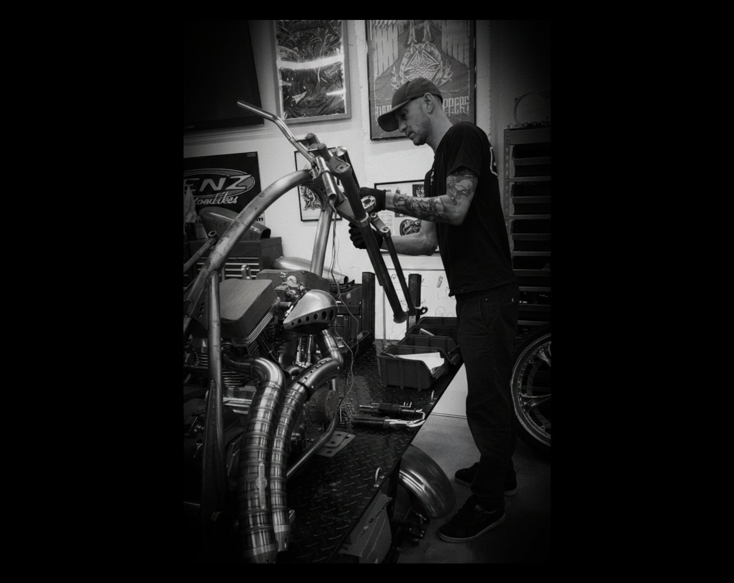 Chris Marschka founder of Famous Fabricator working on a custom Harley-Davidson chopper